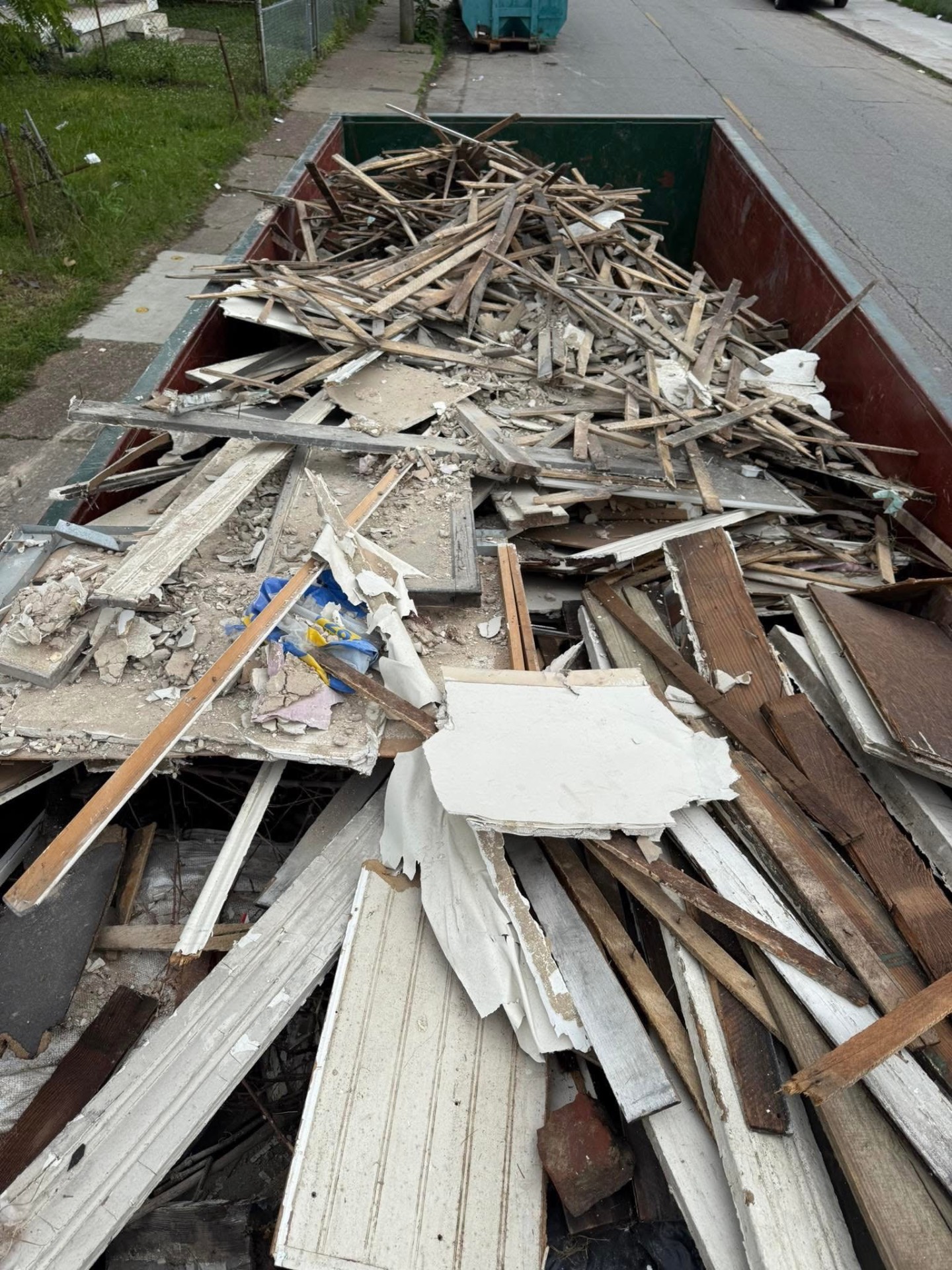 DEMO HAUL: Full roll-off loaded with interior demo debris.