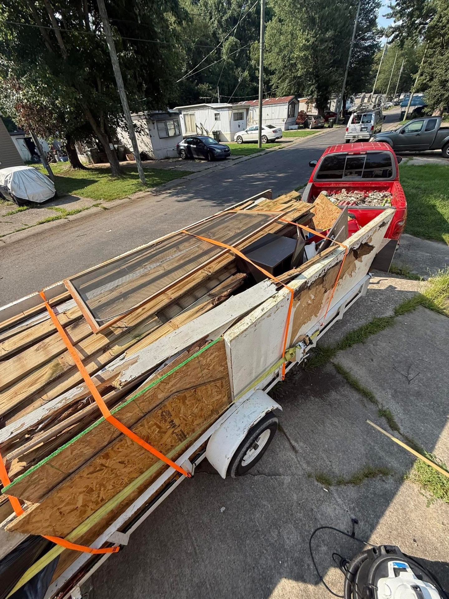LUMBER RUN: Strapped down and rolling out of a mobile home cleanout.